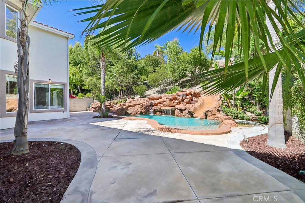 Back yard patio, rock pool and slide - 17218 Blue Spruce, Yorba Linda CA 92886 - photo 58