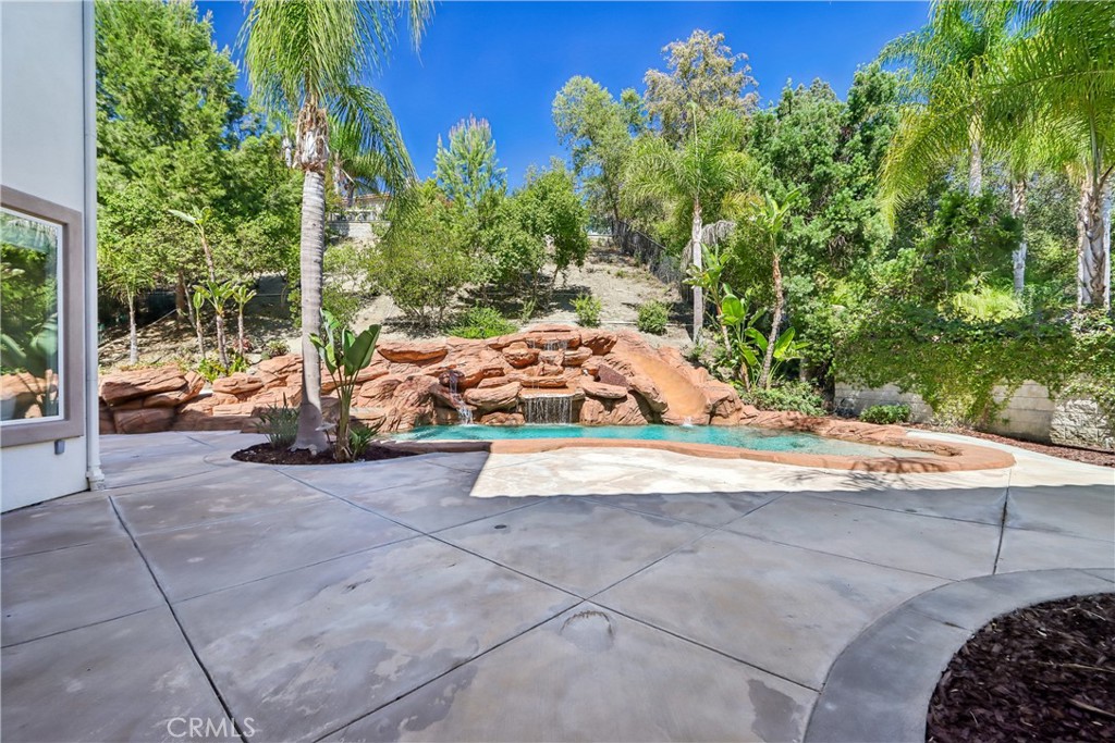 Back yard patio, rock pool and slide - 17218 Blue Spruce, Yorba Linda CA 92886 - photo 59