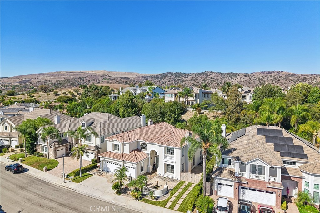Aerial view with view of front and storage parking pad on side of home. - 17218 Blue Spruce, Yorba Linda CA 92886 - photo 64