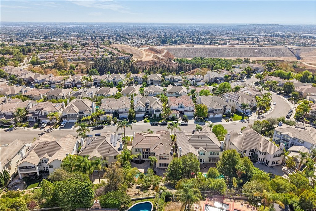 Aerial view of home and neighborhood with view of Redwood Grove, the largest grove of coastal redwoods in Southern Calif - 17218 Blue Spruce, Yorba Linda CA 92886 - photo 68
