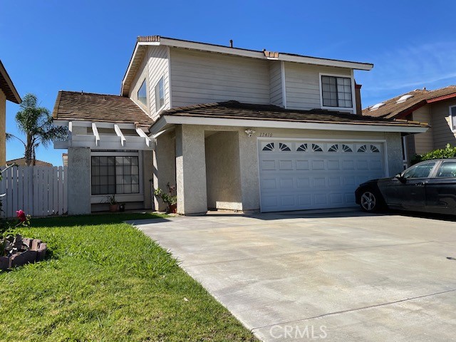 Beautiful two-story home featuring a classic tile roof and spacious two-car garage. The inviting curb appeal includes a - 17410 Marda Ave, Yorba Linda CA 92886 - photo 1