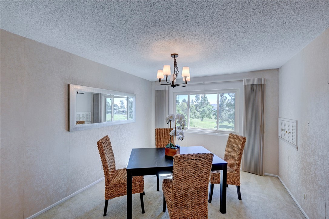 Formal dining room with a view of the green golf course. - 19402 Old Ranch, Yorba Linda CA 92886 - photo 3