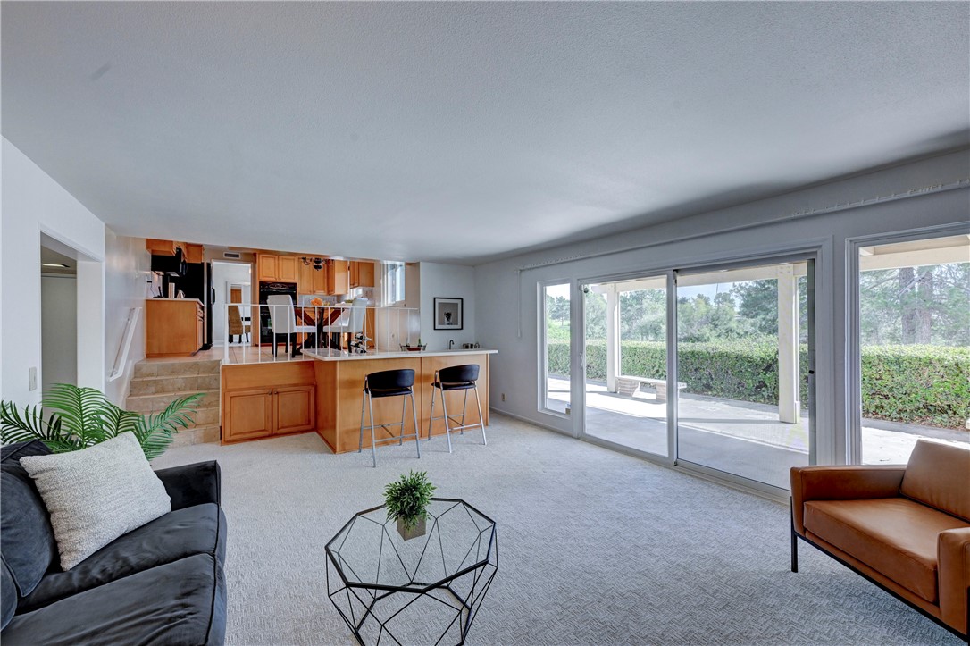 Great open concept space with kitchen, den and slider to the patio. - 19402 Old Ranch, Yorba Linda CA 92886 - photo 5