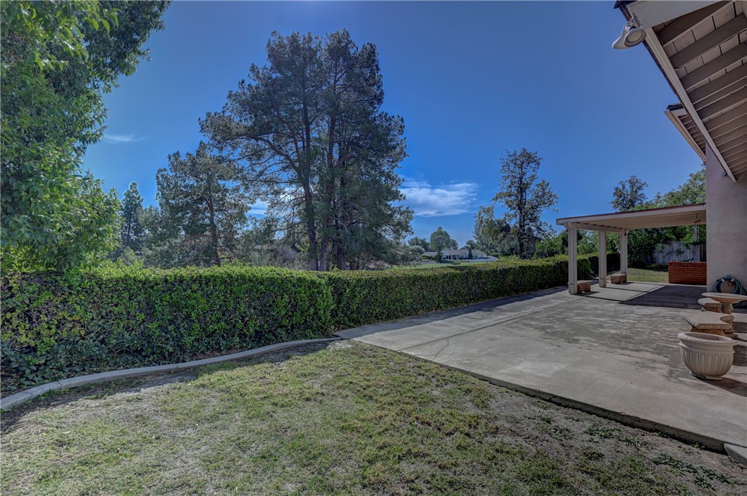 Lawns on both sides of the house. - 19402 Old Ranch, Yorba Linda CA 92886 - photo 32