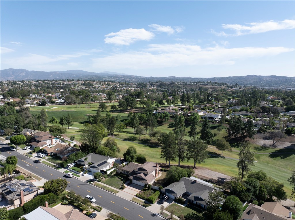 An aerial view of the house, the fairway and beyond. - 19402 Old Ranch, Yorba Linda CA 92886 - photo 36