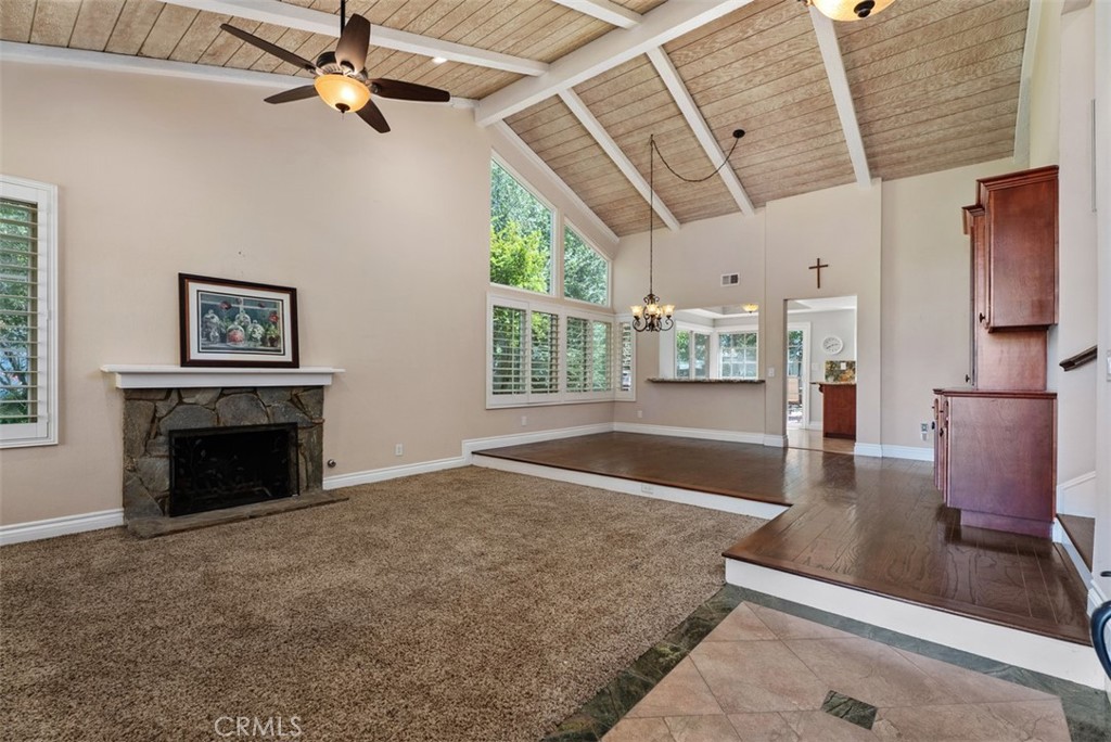 Walk in on tile flooring to the formal living room and step up to the formal dining room. Note the ceiling fan and gas s - 21674 Calle Alcazar, Yorba Linda CA 92887 - photo 4