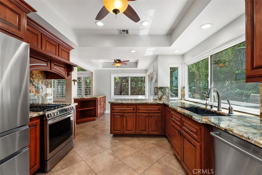 Looking toward the kitchen bar and nook area for additional eating spots. - 21674 Calle Alcazar, Yorba Linda CA 92887 - photo 11
