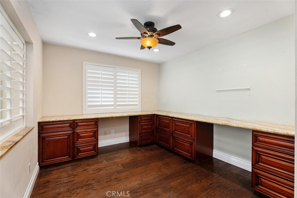 Downstairs bedroom/office with recessed lighting, lighted ceiling fan and shutters on the opening to the den on the left - 21674 Calle Alcazar, Yorba Linda CA 92887 - photo 16