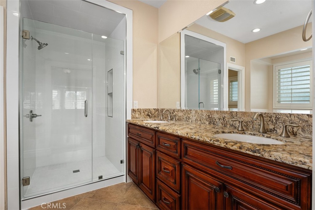 Primary bath with dual sinks, a new walk in shower and not in this photo a tub too. - 21674 Calle Alcazar, Yorba Linda CA 92887 - photo 24