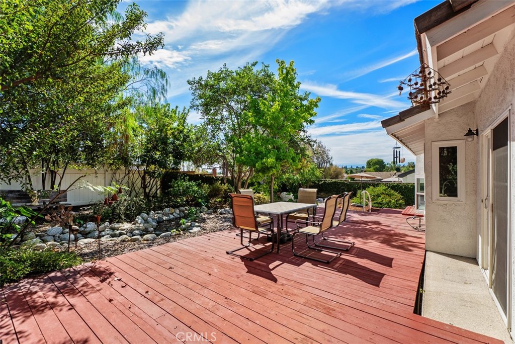 A lush relaxing backyard with wood deck and running stream. - 21674 Calle Alcazar, Yorba Linda CA 92887 - photo 26