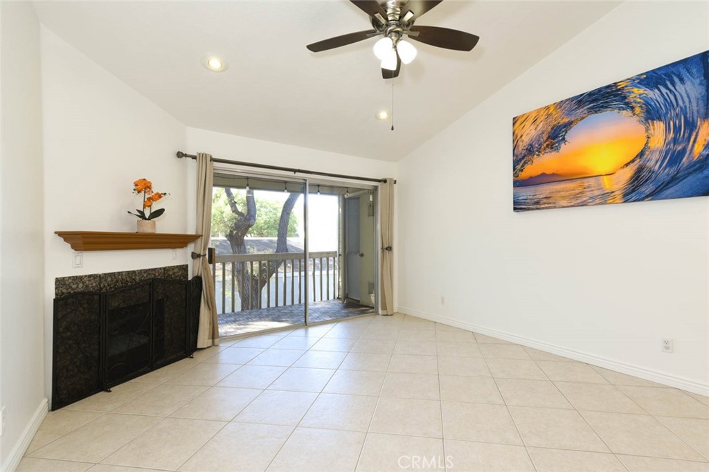 The sliding doors leads to the private balcony with the washer and dryer in the closet on the right side of the balcony. - 23472 Cambridge Road 297, Yorba Linda CA 92887 - photo 5