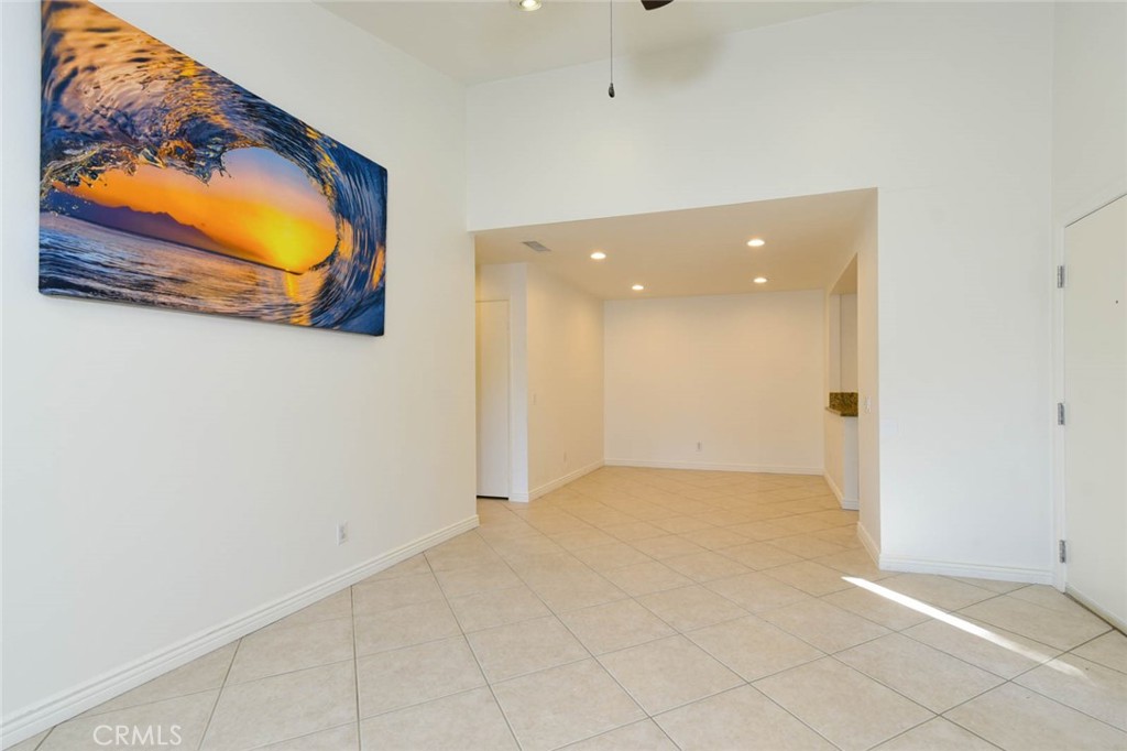 Looking into the dining room from the living room. The dining room also has recess ceiling lights. - 23472 Cambridge Road 297, Yorba Linda CA 92887 - photo 6