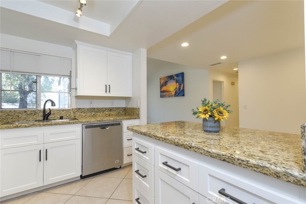 Ample storage space in the kitchen and everything is in great condition. - 23472 Cambridge Road 297, Yorba Linda CA 92887 - photo 13
