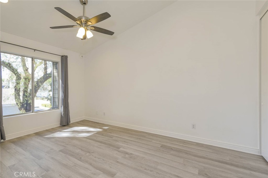 The primary bedroom suite is private with no sharing door and high ceiling with ceiling fan and the recess ceiling light - 23472 Cambridge Road 297, Yorba Linda CA 92887 - photo 14