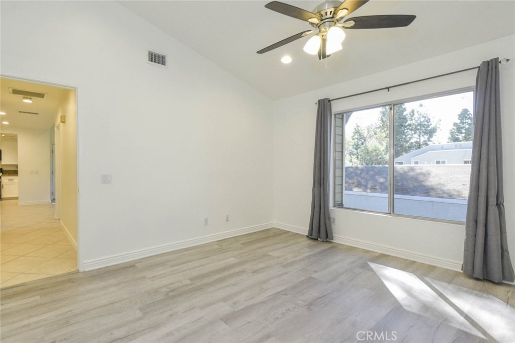 Primary bedroom with high ceiling. - 23472 Cambridge Road 297, Yorba Linda CA 92887 - photo 17