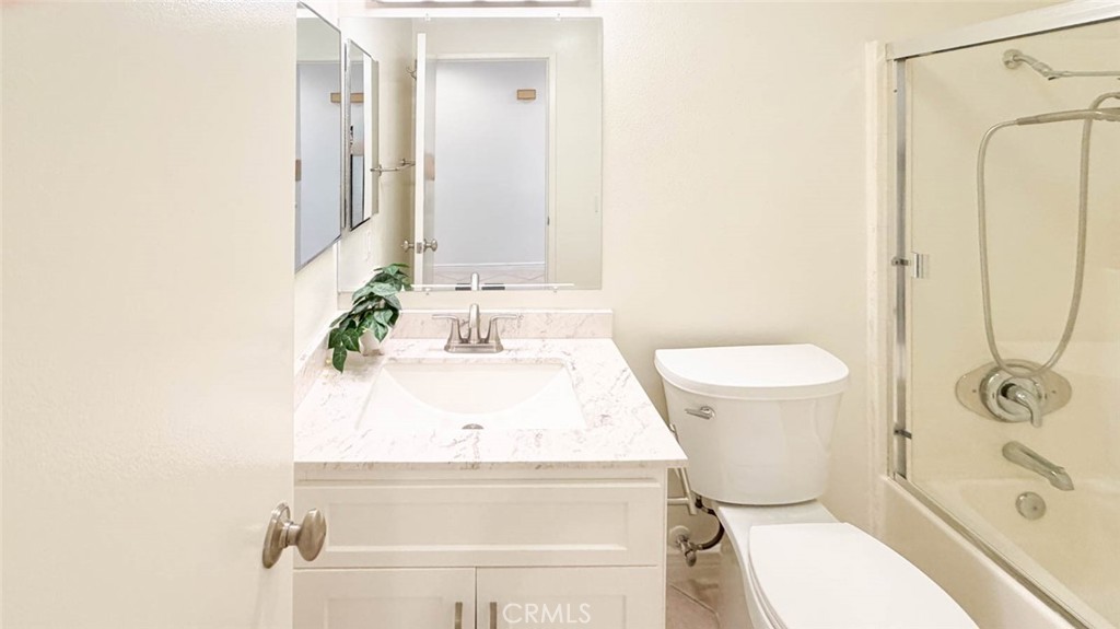 The hall way bathroom has nice vanity and a tub/shower combo. - 23472 Cambridge Road 297, Yorba Linda CA 92887 - photo 23