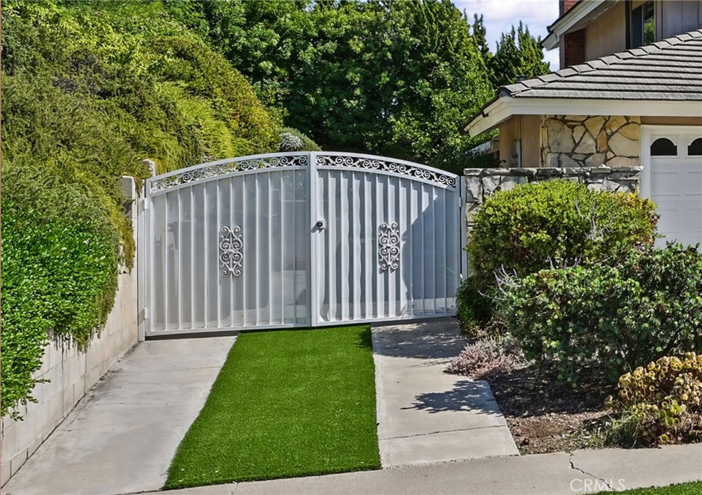 Private RV gated parking. East to maintain turf sits in the middle of the driving lane. - 5062 W Knoll Drive, Yorba Linda CA 92886 - photo 6