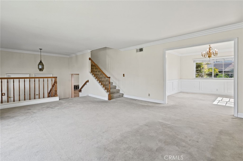 Vies of the living room looking into the dining room and stairs that lead to 3 of the 4 upstairs bedrooms - 5062 W Knoll Drive, Yorba Linda CA 92886 - photo 15