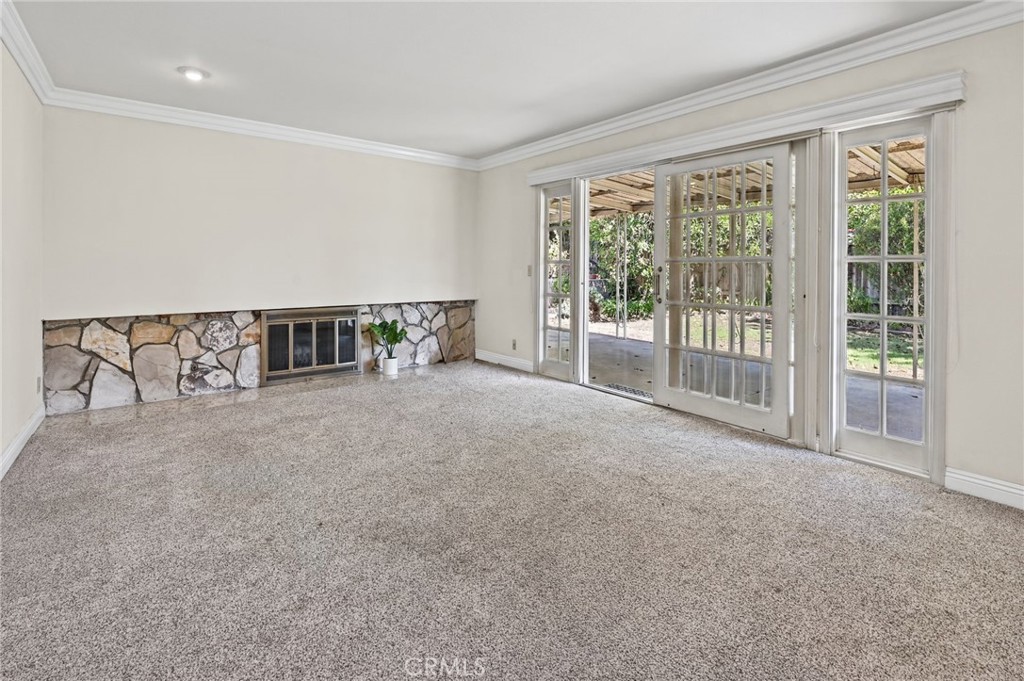 The family room has a gorgeous fireplace and sliding door leading to the backyard - 5062 W Knoll Drive, Yorba Linda CA 92886 - photo 21