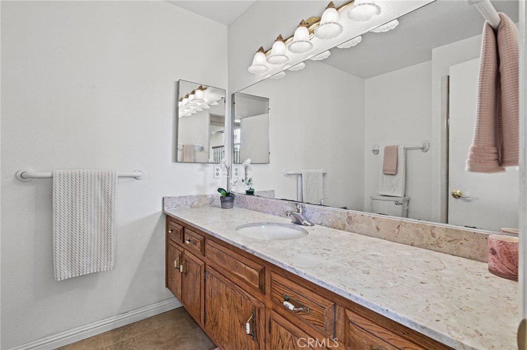 Downstairs Bathroom with a large vanity and a walk in tiled shower - 5062 W Knoll Drive, Yorba Linda CA 92886 - photo 28