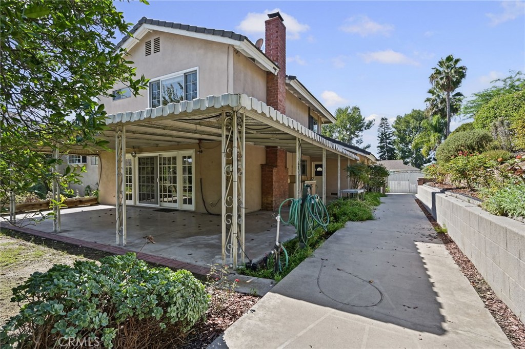 View of the side yard with the wrought iron RV gate in the distance - 5062 W Knoll Drive, Yorba Linda CA 92886 - photo 45