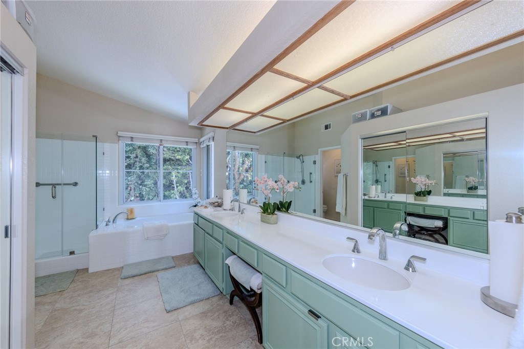 Primary suite private bath with double vanity with make-up desk, large soaking tub, walk-in shower and privacy commode r - 5505 Green Hollow Lane, Yorba Linda CA 92887 - photo 13