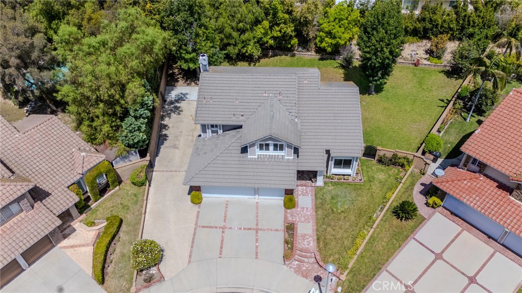 Aerial view with a closer look at the front of the home with the huge gated RV parking to the left and the sprawling poo - 5505 Green Hollow Lane, Yorba Linda CA 92887 - photo 24