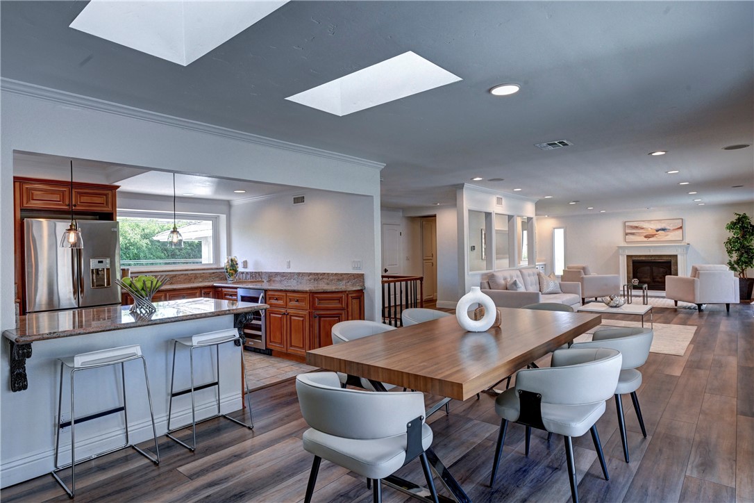 Note the skylights letting in lots of natural light in this open concept living area. - 5561 Orchard, Yorba Linda CA 92886 - photo 4