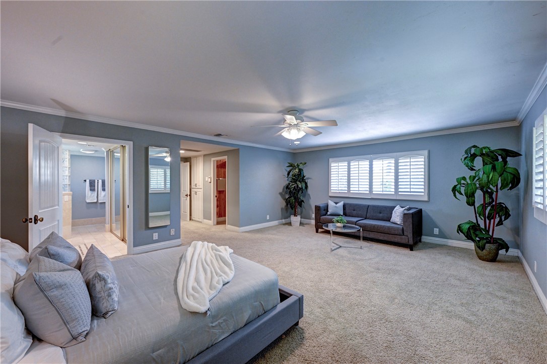 Note the cedar lined walk in closet by the entrance of the primary suite. The mirror on the wall is an ironing board. - 5561 Orchard, Yorba Linda CA 92886 - photo 6