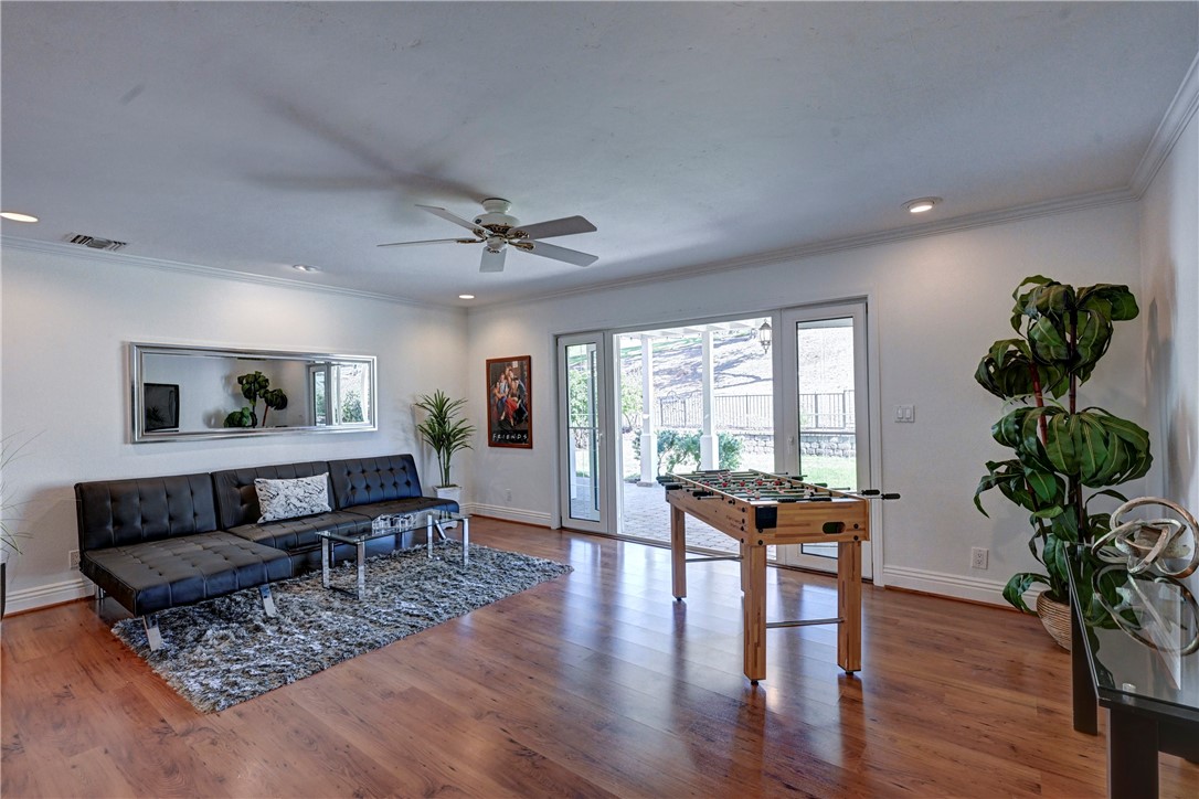 Spacious den with wood type flooring, ceiling fan and recessed lighting with French doors leading out to the backyard. - 5561 Orchard, Yorba Linda CA 92886 - photo 7