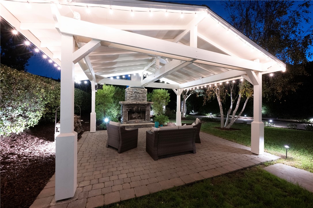 Outdoor entertaining with this stone fireplace in this covered patio. - 5561 Orchard, Yorba Linda CA 92886 - photo 9