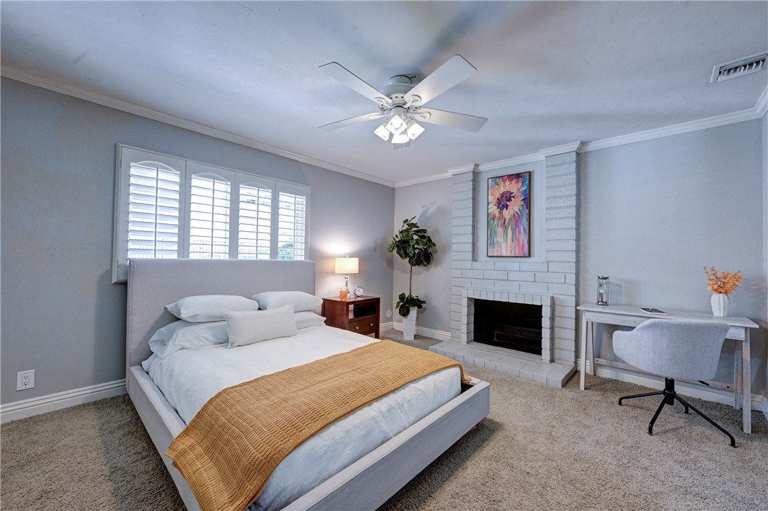 Downstairs bedroom #3 has it's own gas starter fireplace. - 5561 Orchard, Yorba Linda CA 92886 - photo 31