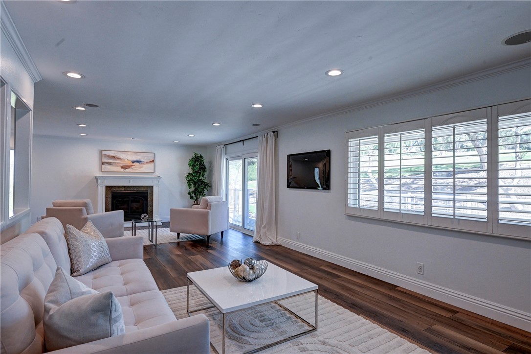Wood type flooring, recessed lighting, shutters on the windows and two sliders to the balcony looking out over the golf - 5561 Orchard, Yorba Linda CA 92886 - photo 43