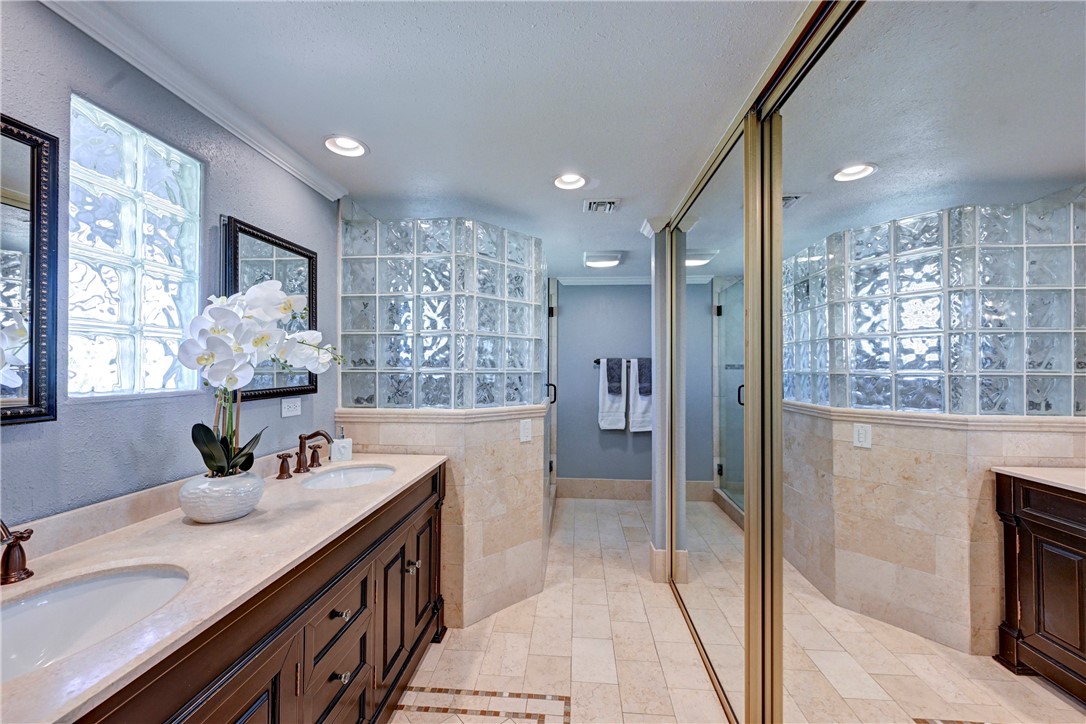 Dual sinks and mirrored wardrobe doors in the primary bath. - 5561 Orchard, Yorba Linda CA 92886 - photo 51