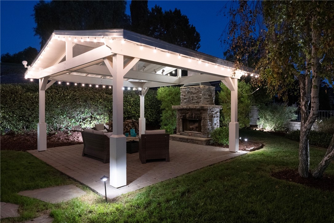 Stone walkways from the driveway and house to this large covered patio. - 5561 Orchard, Yorba Linda CA 92886 - photo 58