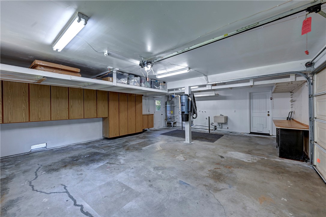 Spacious garage with work bench, laundry area & sink. - 5561 Orchard, Yorba Linda CA 92886 - photo 67