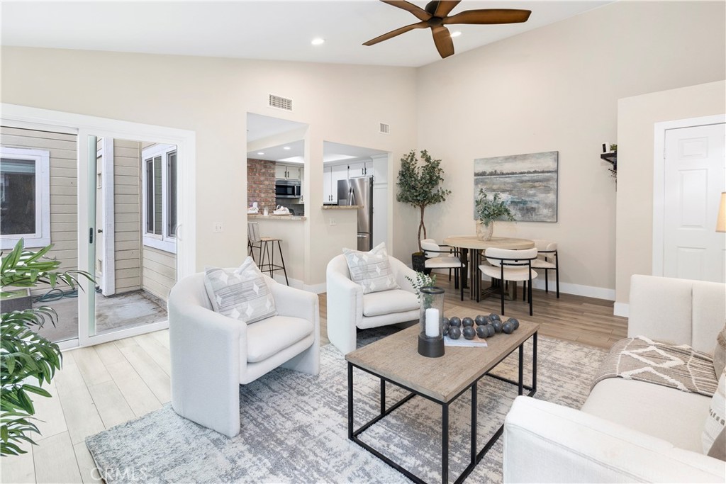 living room open to patio - 5920 Bedford Ct. 137, Yorba Linda CA 92887 - photo 1