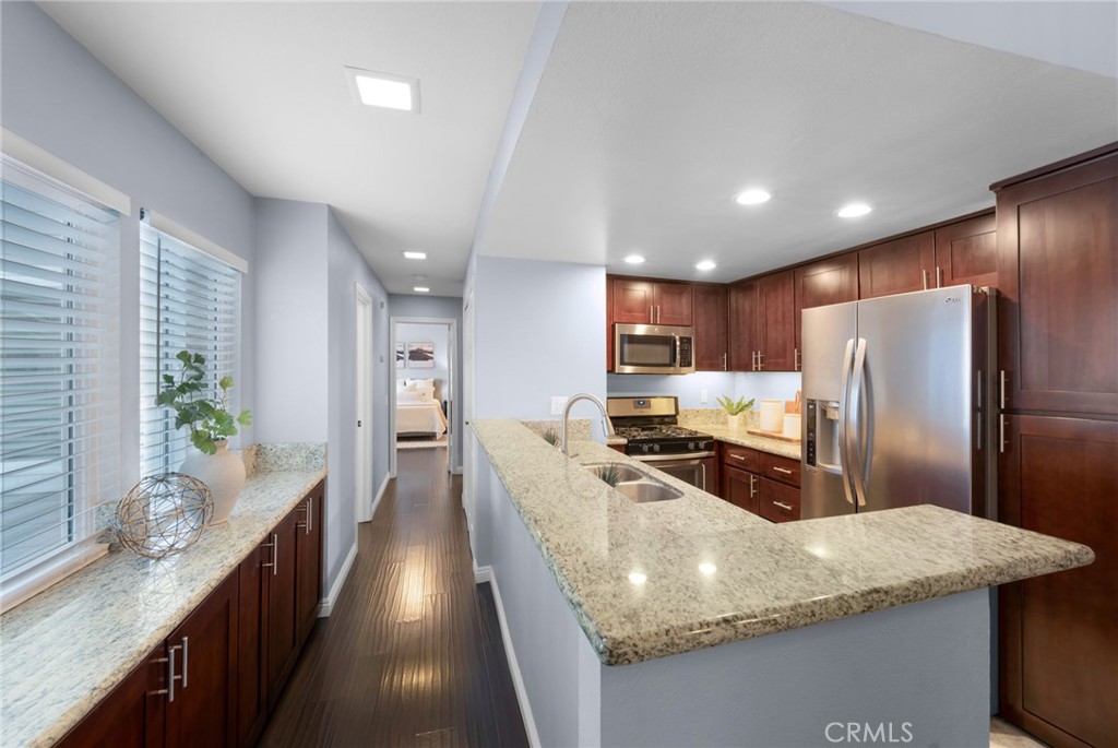 Kitchen and​​‌​​​​‌​​‌‌​​‌‌​​‌‌​​‌​​​‌‌​‌​​​​‌‌​‌​​ Hall - 6223 Newhaven Ct #122, Yorba Linda CA 92887 - photo 15
